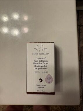Drunk Elephant D-Bronzi Sunshine Drops — White Box with Bronze Accents